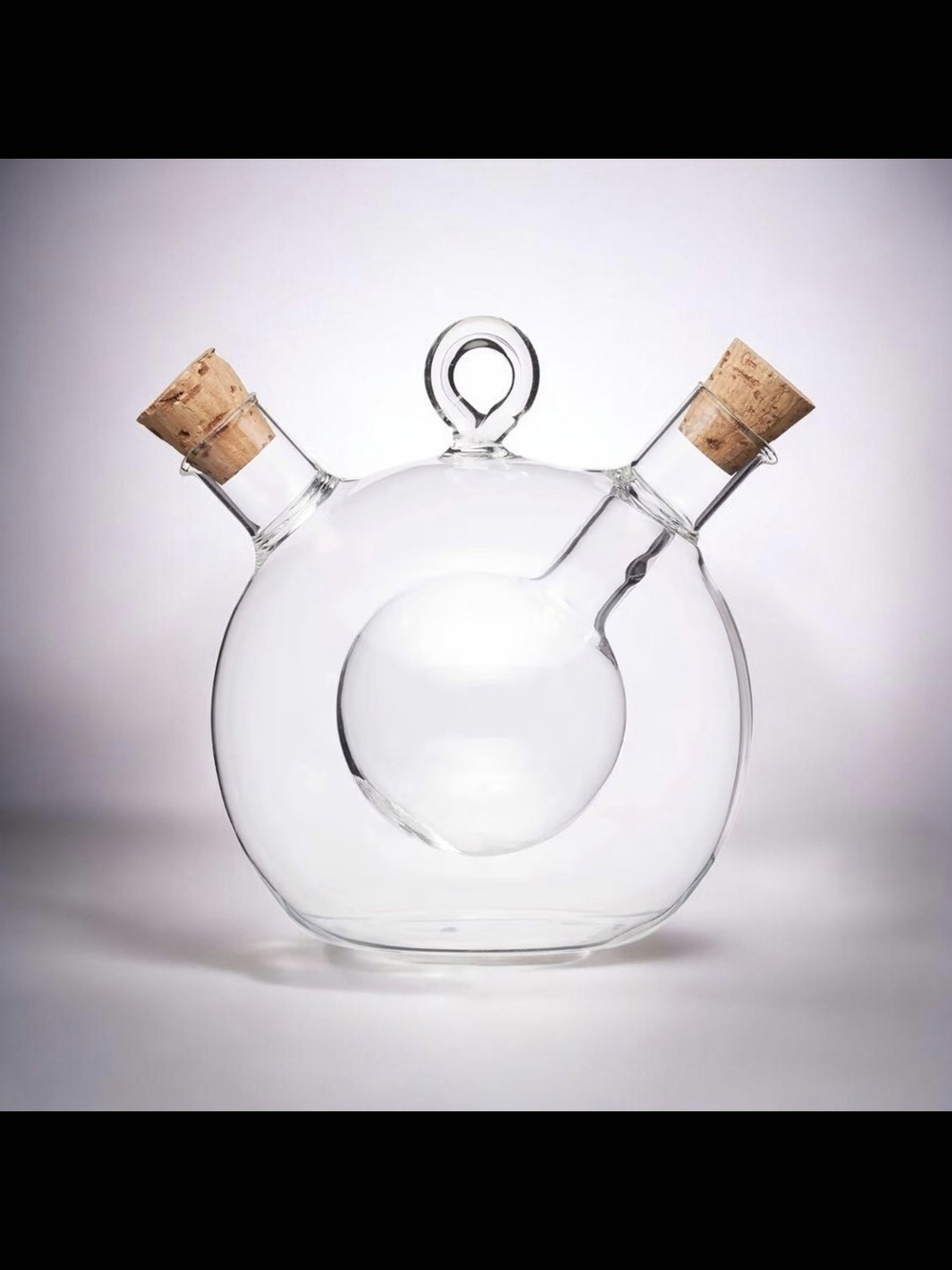 KitchenCraft World of Flavours 2-in-1 glass olive oil and vinegar dispenser.